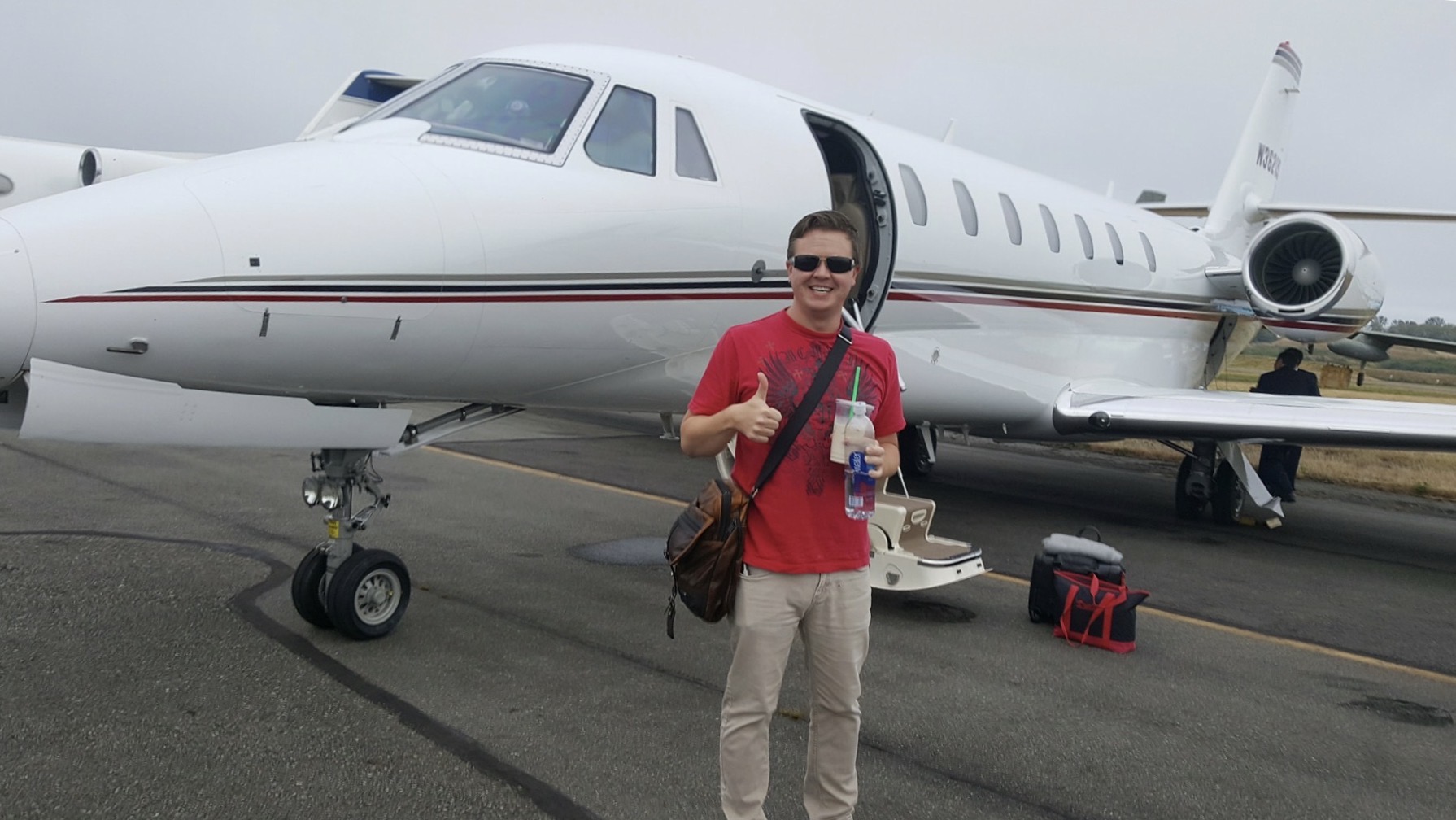 Joshua boarding jet with company CEO